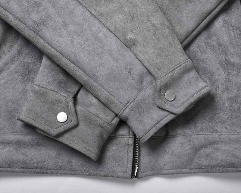 Close up of Hipok Brand grey suede jacket sleeves with buttoned cuffs and zipper detail