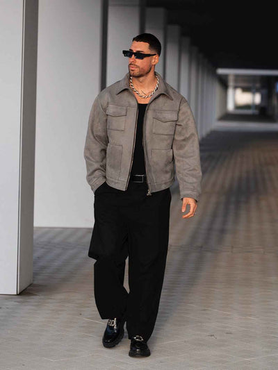 Hipok Brand Grey Suede Jacket worn by a man with black pants and sunglasses walking outdoors