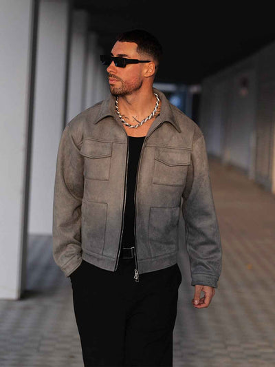 Man wearing Hipok Brand grey suede jacket styled with black pants and sunglasses